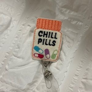 BRAND NEW chill pills badge reel